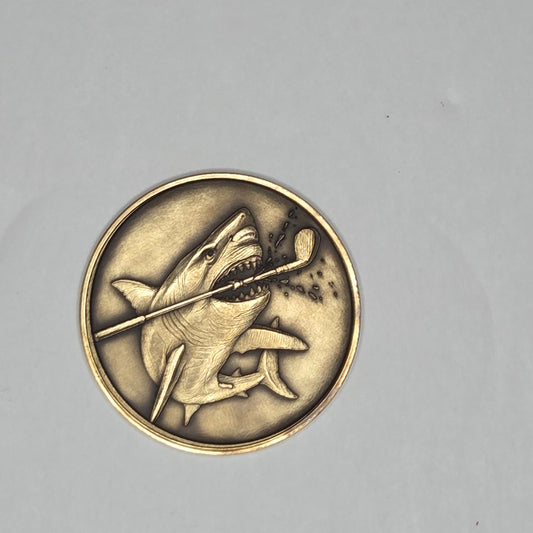 Bronze coin with a design on a gray background