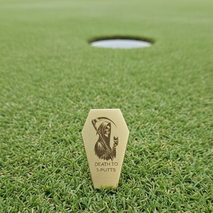 Golf marker with a design on a grassy golf course