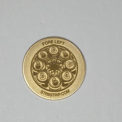 Gold coin with intricate design on a gray background