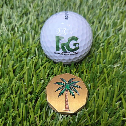 Golf ball and cap on a grassy surface