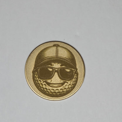 Gold coin with a design on a gray background